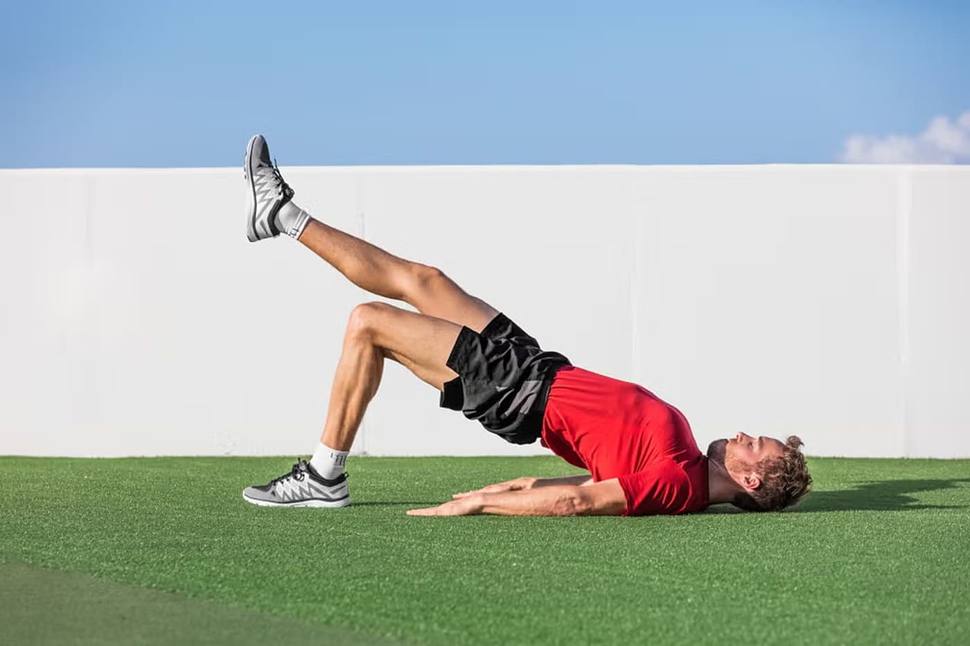 Single-leg glute bridge hold position
