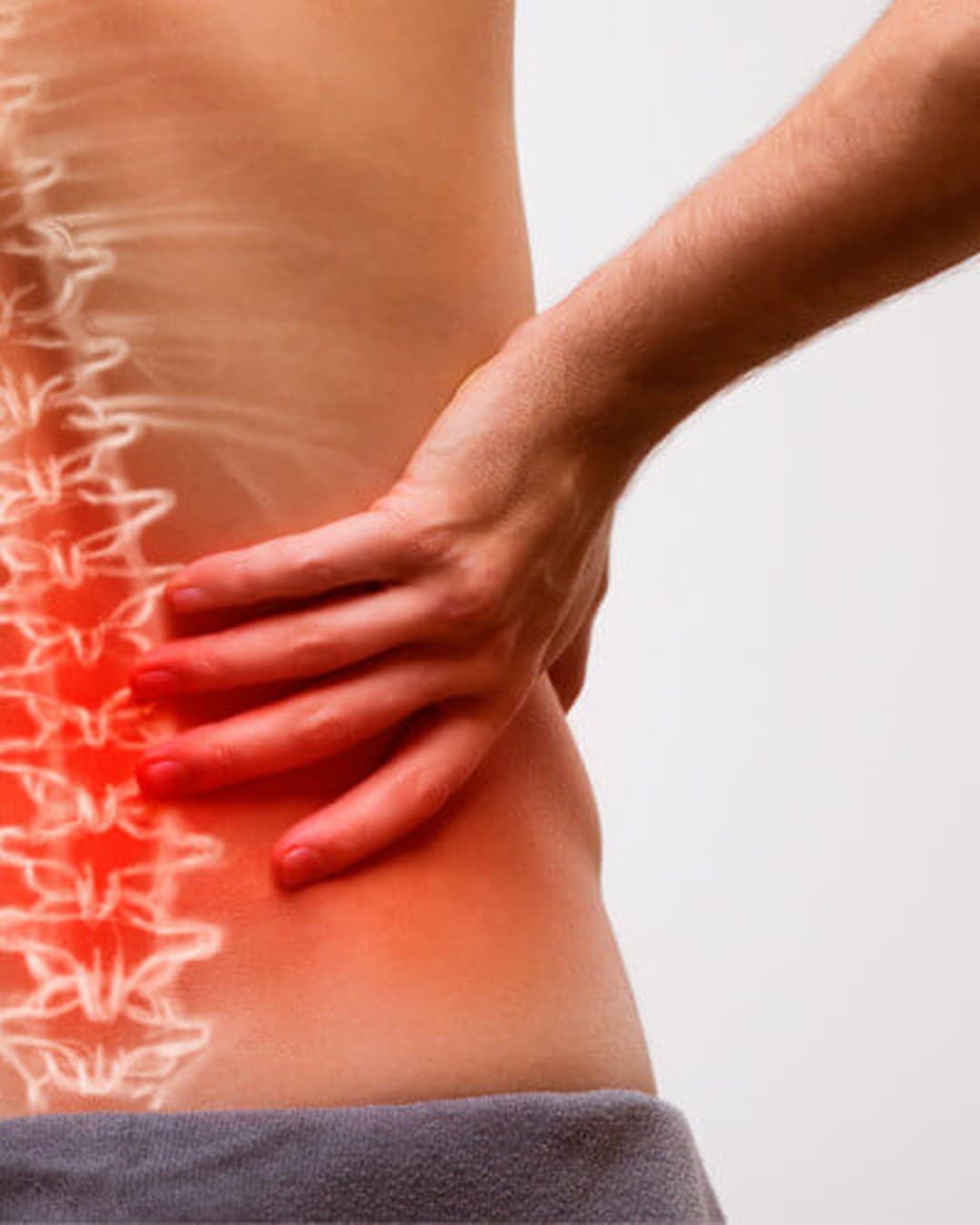 Physiotherapist assessing hip and lower back function
