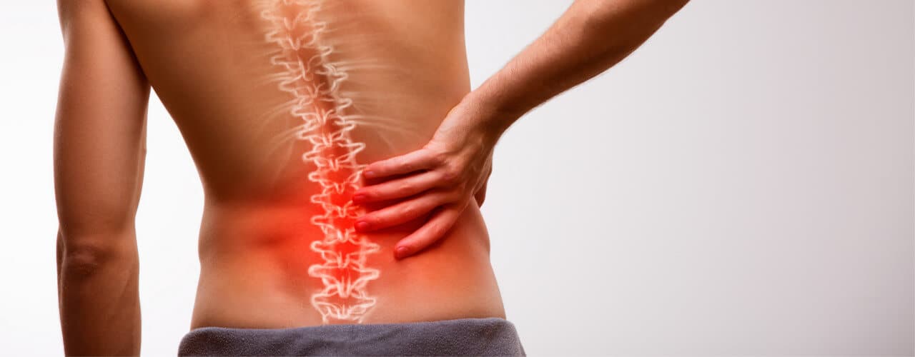 Physiotherapist assessing hip and lower back function